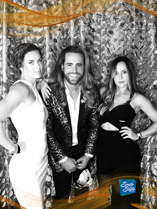 3 people taking a photo.