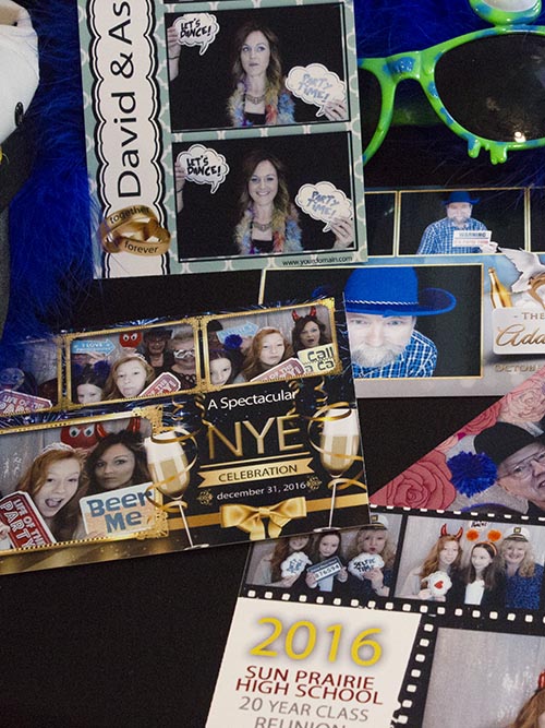 A bunch of photos laying on a table.