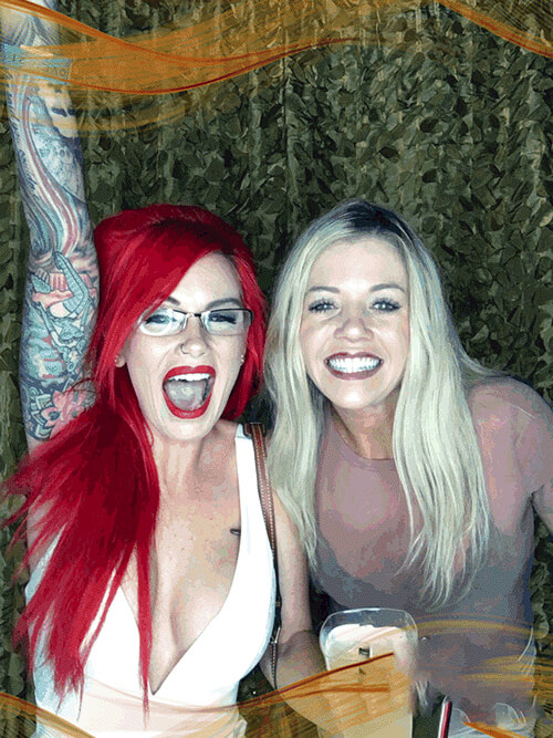 Girls dancing in front of a Photo Booth